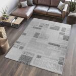 Modern living room with geometric patterned rug.