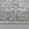 Gray patterned rug on wooden floor