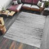 Modern living room with gray area rug.