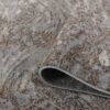 Close-up of textured beige and gray rug.