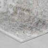 Gray abstract patterned rug on wood floor