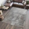 Modern living room with gray textured area rug.
