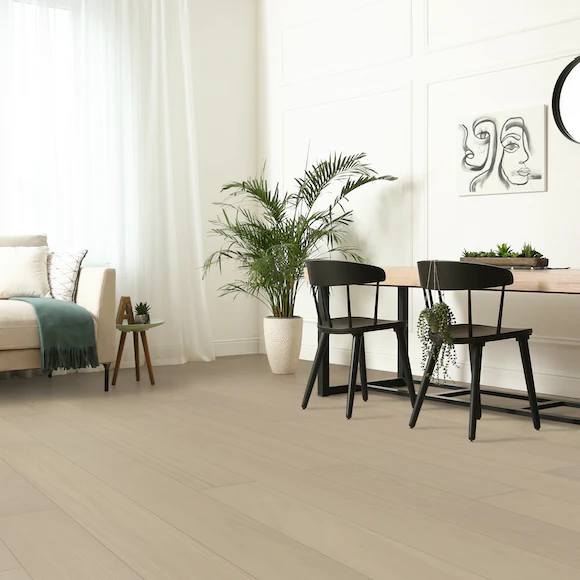 Modern living room with plants and dining area.