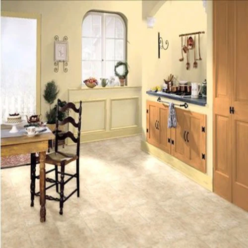 Cozy kitchen with wooden cabinets and dining table.