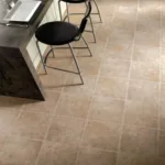 Modern kitchen with tiled floor and bar stools