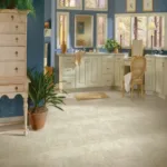 Bright bathroom with double sink vanity and windows.
