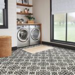 Laundry room with patterned tile flooring.