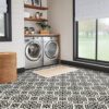 Modern laundry room with patterned tile floor