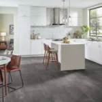 Modern kitchen with white cabinets and gray tile floor