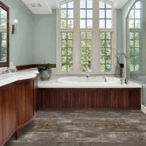 Modern bathroom with large windows and wood vanity.
