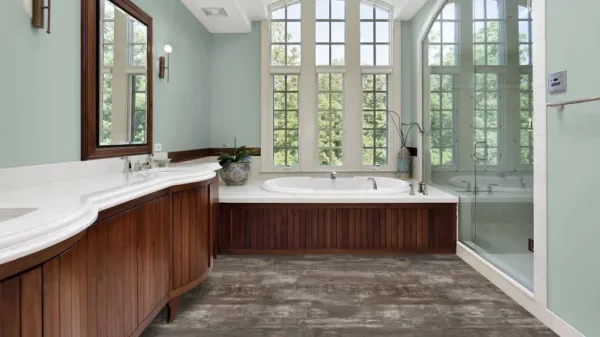 Modern bathroom with large windows and wood vanity.