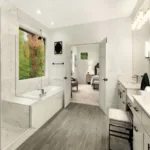 Modern bathroom with large tub and double vanity