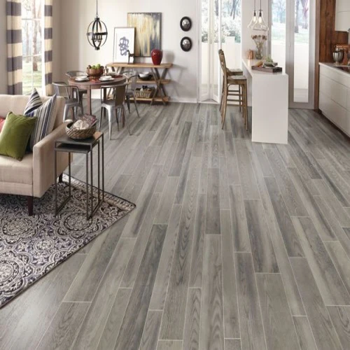Modern open living and dining room with wood flooring.