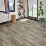 Modern laundry room with gray wood floor