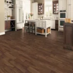 Modern kitchen with dark hardwood flooring