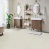 Modern bathroom with double sinks and wooden shelving.