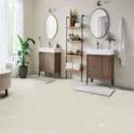 Modern bathroom with double sinks and wooden shelving.