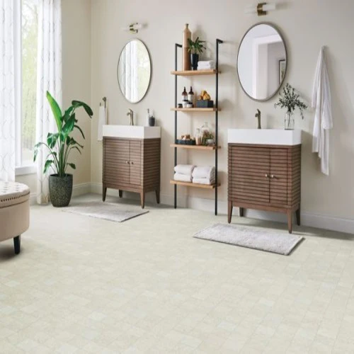 Modern bathroom with double sinks and wooden shelving.