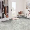 Modern entryway with bike and coats on racks.