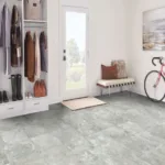 Modern entryway with bike and coats on racks.