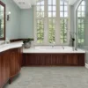 Spacious bathroom with wooden cabinets and large windows