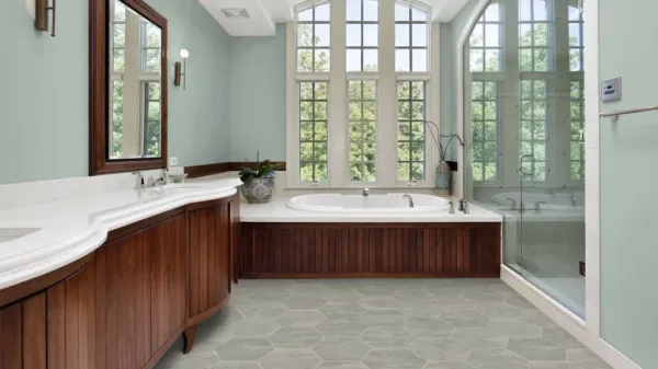 Spacious bathroom with wooden cabinets and large windows