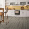Modern kitchen with wooden floor and island chair