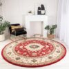Elegant room with red round rug and plants.