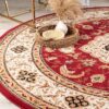 Elegant round rug with floral patterns and decor.