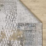 Abstract patterned rug on wooden floor