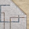 Modern geometric pattern rug on wooden floor