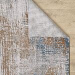 Textured rug on wooden floor, corner folded.