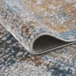 Close-up of textured patterned area rug corner