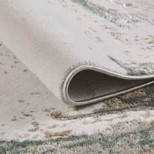 Close-up of rolled gray and green area rug