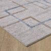 Geometric patterned rug on wooden floor