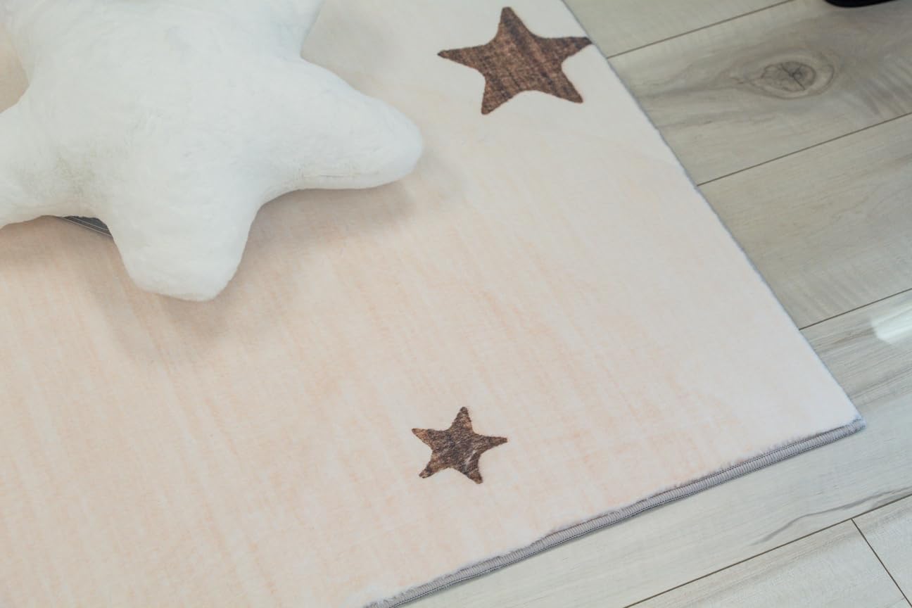 White star pillow on wooden floor beside rug