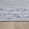Close-up of patterned rug on wooden floor