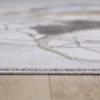 Close-up of patterned rug on wooden floor
