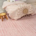 Cozy bedroom with pink bedding and decor