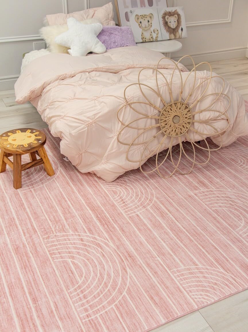 Cozy bedroom with pink bedding and decor