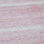 Close-up of soft pink textured fabric.