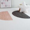 Modern rug with geometric patterns and alphabet decor.