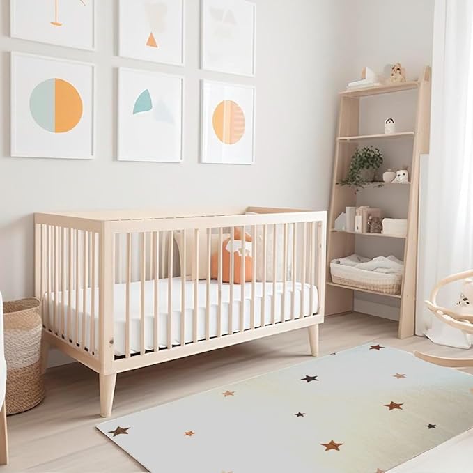 Modern nursery with crib and geometric wall art.