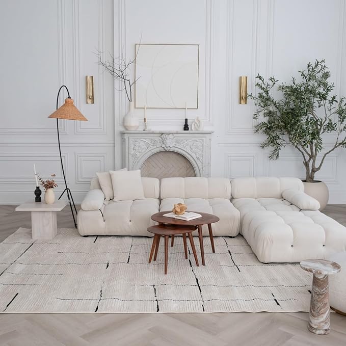 Modern living room with white sofa and plants.