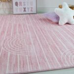 Cozy pink carpet with modern design in bedroom.