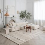 Modern living room with neutral-toned decor and furniture.