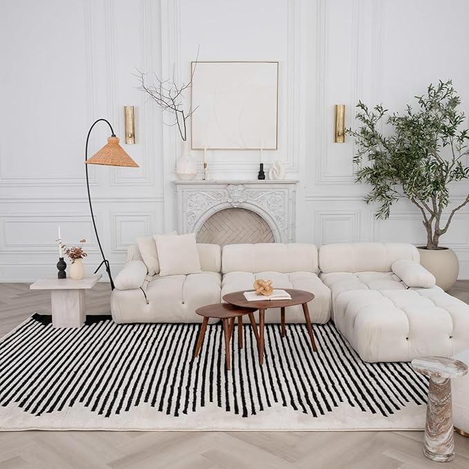 Modern living room with white sofa and decor.
