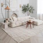 Modern living room with white sectional sofa.