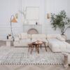 Modern living room with white sectional sofa.