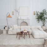 Elegant living room with white sofa and decor.